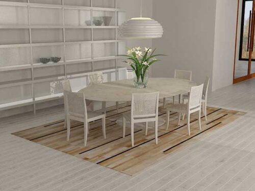 Stripes beige patchwork cowhide rug under a Tulip table in a white bright dining room