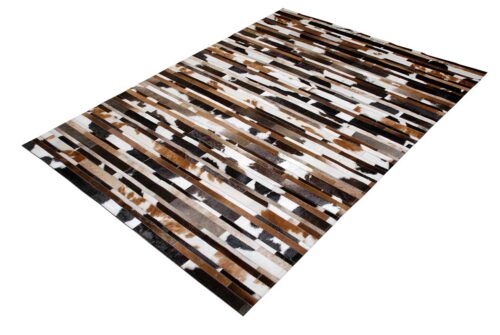 White, brown and black patchwork cowhide rug designed in stripes