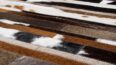 Hair on hide detail of white, brown and black patchwork cowhide rug designed in stripes
