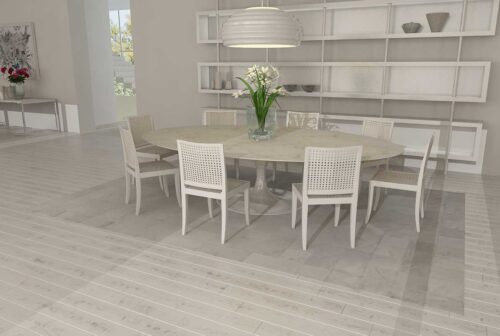 Patchwork cowhide rug in white squares in dining room
