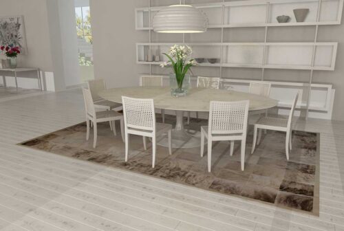 Gray brindle patchwork cowhide rug in a modern white dining room