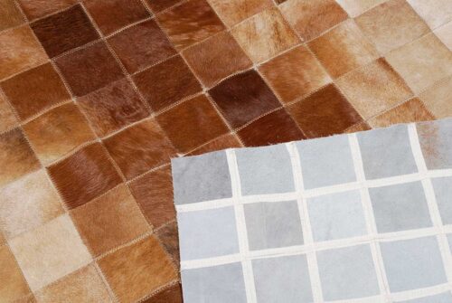 Detail of a Beige and Brown Gradient Patchwork Cowhide Rug and backing