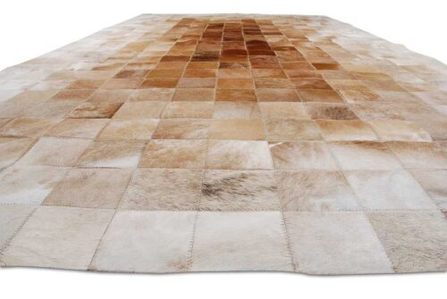 Close-up view of a Beige and Brown Gradient Patchwork Cowhide Rug in 4 inches Squares
