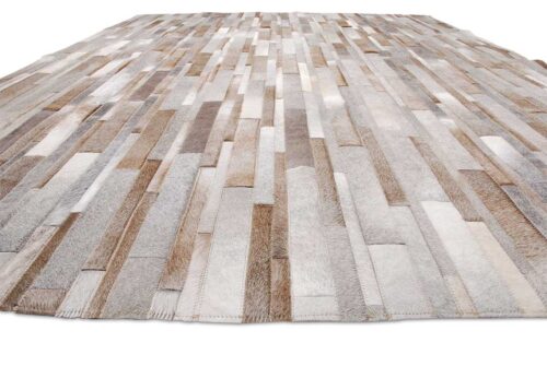 Gray, beige and white patchwork cowhide rug in Stripes