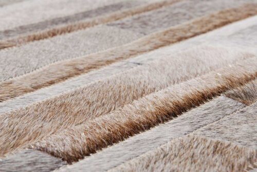 Hair on hide detail of Gray, beige and white patchwork leather area rug in Stripes design