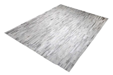 Grey and white patchwork cowhide rug in stripes Grey and white patchwork cowhide rug in stripes