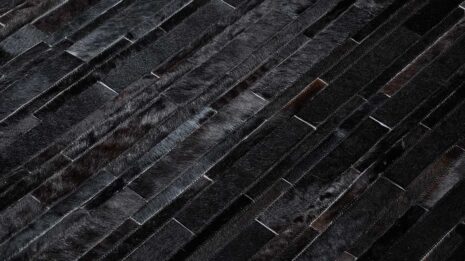 Detail of a Black Patchwork Cowhide Rug Design in stripes