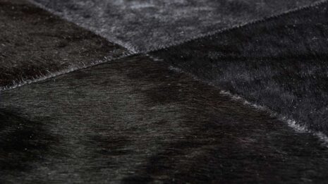 Zoom of Black Patchwork Cowhide Rug
