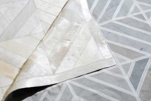 Beige patchwork cowhide rug in diamond design with backing Beige patchwork cowhide rug in diamond design with backing