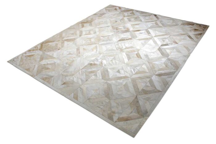 Beige cowhide patchwork rug in diamond design