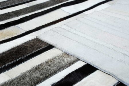 White, gray and black leather area rug in stripes with backing White, gray and black leather area rug in stripes with backing