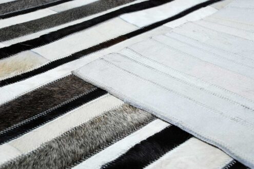 White, gray and black leather area rug in stripes with backing White, gray and black leather area rug in stripes with backing