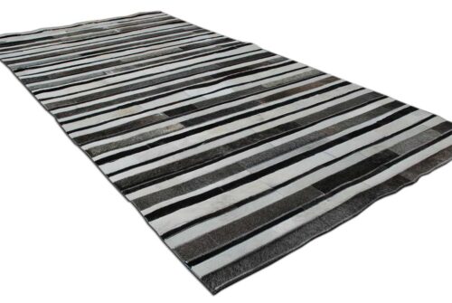 White, gray and black patchwork cowhide rug in stripes