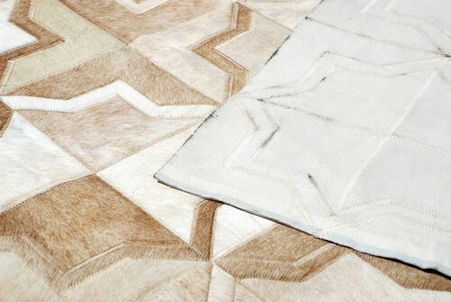 detail of the beige cowhide patchwork rug in the moorish star design showing full backing