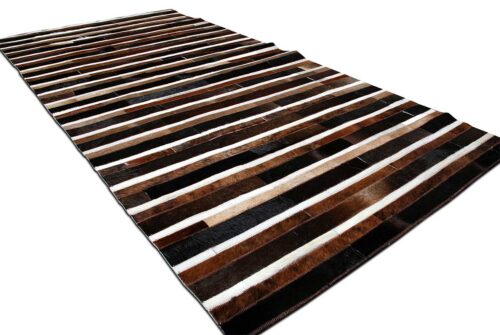 Black, brown and white leather area rug in stripes
