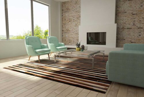 Black, brown and white patchwork cowhide rug in sunny living room