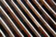 Top detail of black, brown and white patchwork cowhide rug in stripes