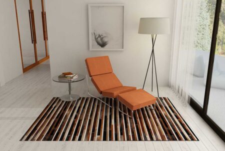 Black, brown and white patchwork cowhide rug in reading nook Black, brown and white patchwork cowhide rug in reading nook