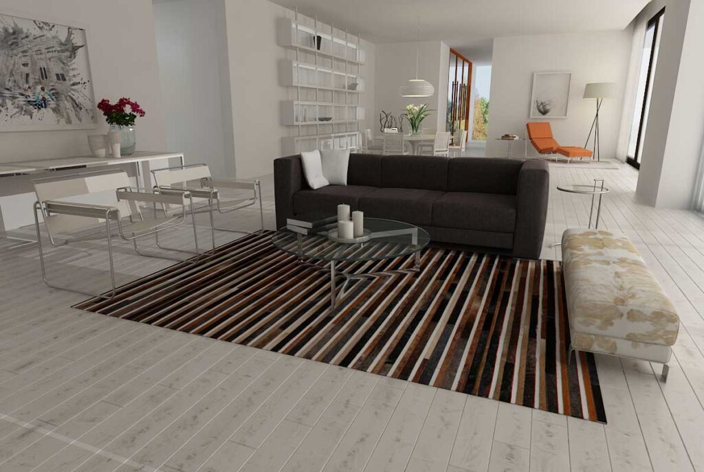 Black, brown and white patchwork cowhide rug in minimal living room