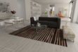 Black, brown and white patchwork cowhide rug in minimal living room