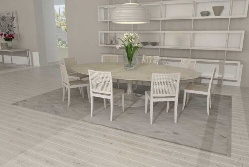 Chevron gray cowhide patchwork rug in a white dining room