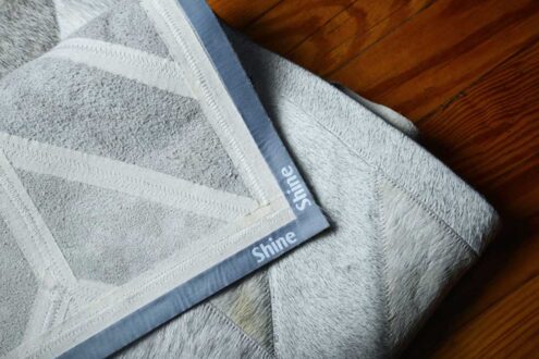 Backing detail of a Classic Gray Chevron Cowhide Patch Rug Backing detail of a Classic Gray Chevron Cowhide Patch Rug