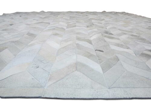 Floor view of a Chevron gray cowhide patchwork rug