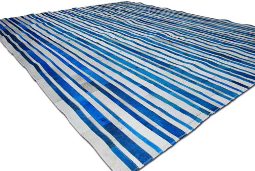 Blue and white cowhide patchwork rug in stripes design
