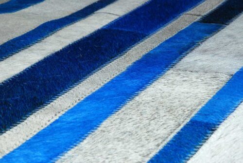 Hair detail of Blue and white cowhide patchwork rug in stripes design