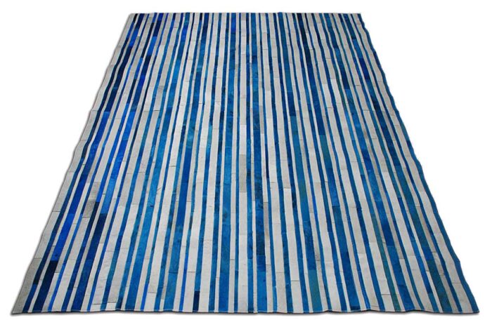 Blue and white cowhide patchwork rug in stripes design