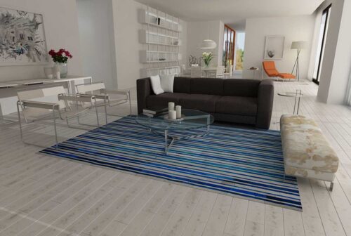 Blue and white natural cowhide patchwork rug in stripes design in a minimal house