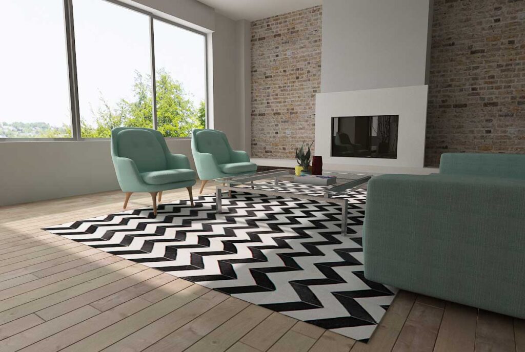 Black and white chevron patchwork cowhide rug in sunny living room