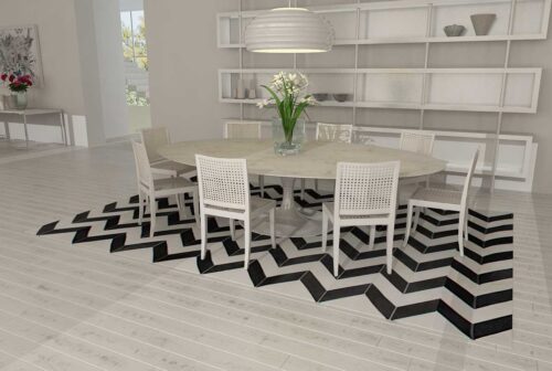 Black and white chevron patchwork cowhide rug in dining room