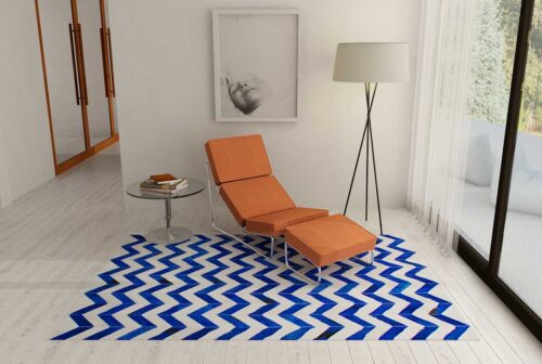 Chevron blue and white cowhide patchwork rug in a reading nook