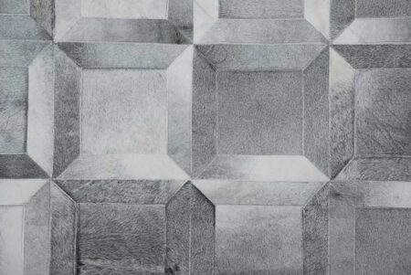 Top view of a gray Cube patchwork cowhide rug Top view of a gray Cube patchwork cowhide rug