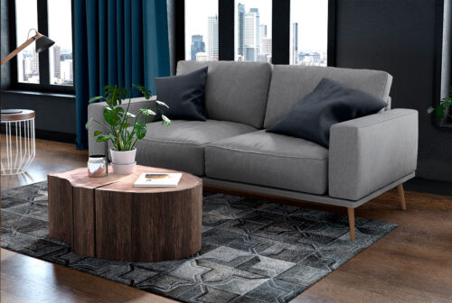 Dark gray patchwork cowhide rug in a moorish star design in a cozy living room