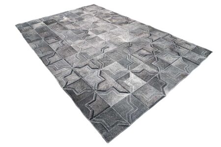 Dark gray patchwork cowhide rug in a moorish star design Dark gray patchwork cowhide rug in a moorish star design
