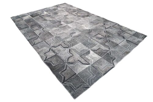 Dark gray patchwork cowhide rug in a moorish star design