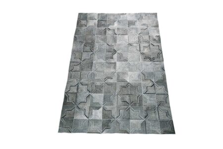 Dark gray patchwork cowhide rug in a moorish star design Dark gray patchwork cowhide rug in a moorish star design