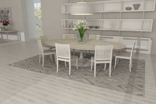 Diamond gray cowhide patchwork rug in a white dining room