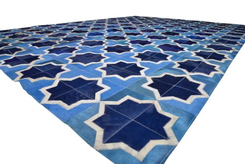 Close up of our Moorish Star Blue and White cowhide patchwork rug