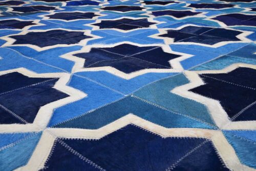 Detail of our Moorish Star Blue and White cowhide patchwork rug