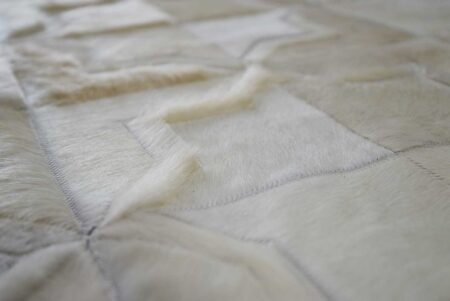 288+++++ Hair detail of white leather area rug in moorish star design