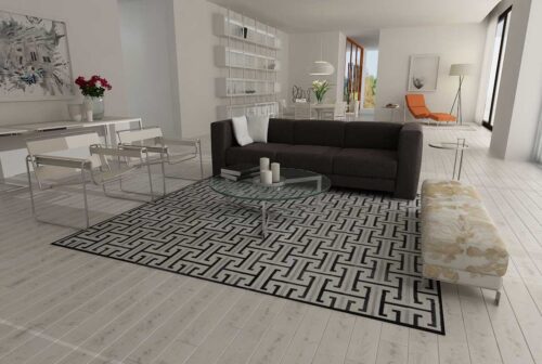 Black, gray and white patchwork cowhide rug design in minimal living room