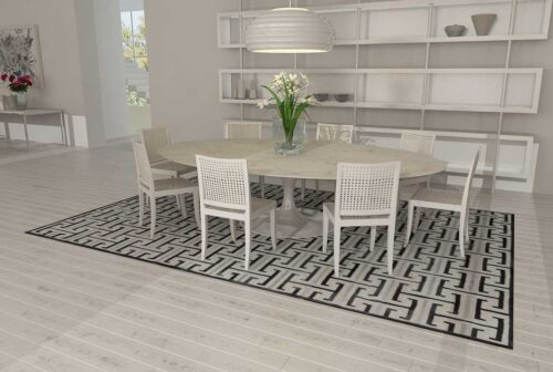 Black, gray and white patchwork cowhide rug design in modern dining room