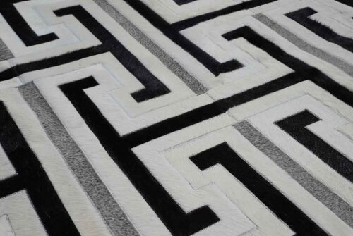 Black, gray and white patchwork cowhide rug design