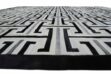 Black, gray and white patchwork cowhide rug design