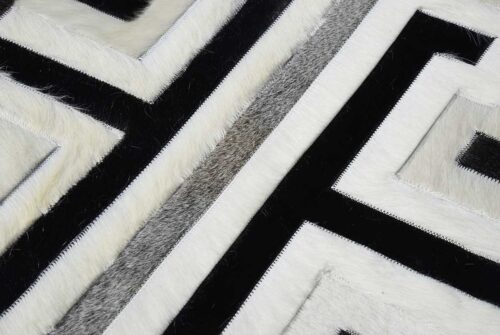 Hair detail of black, gray and white patchwork cowhide rug design