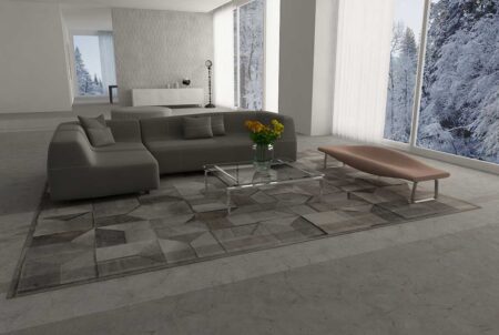 Taupe Gray Envelope Patchwork Cowhide Rug in a loft Taupe Gray Envelope Patchwork Cowhide Rug in a loft