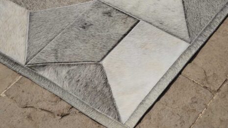 Detail of a Taupe Gray Envelope Patchwork Cowhide Rug